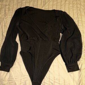 Woman’s black and metallic bodysuits